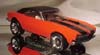 One Hot Orange Camaro with stripes